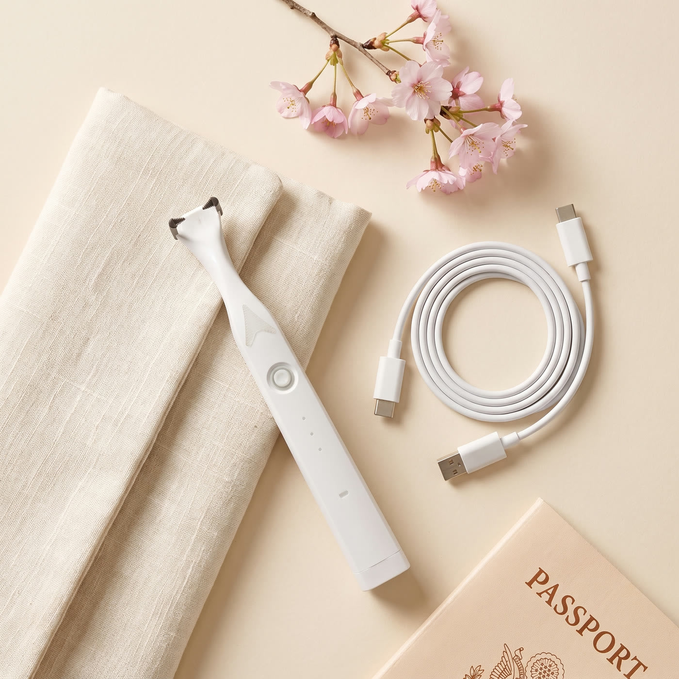 The flosser with its USB-C cable in a travel pouch
