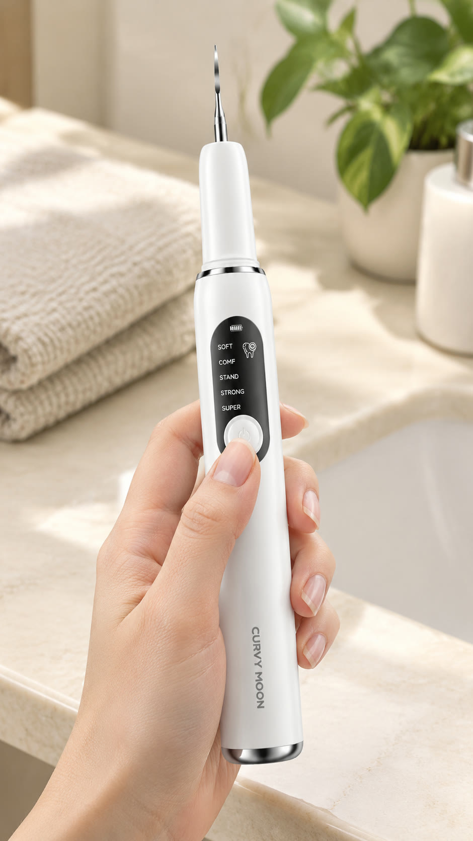 Hand holding the cleaner with its five-mode display facing the camera