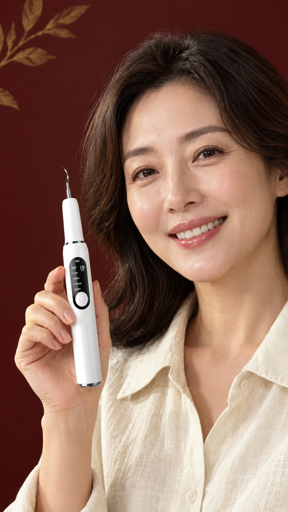 Woman smiling and holding the MOON Ultrasonic Tooth Cleaner